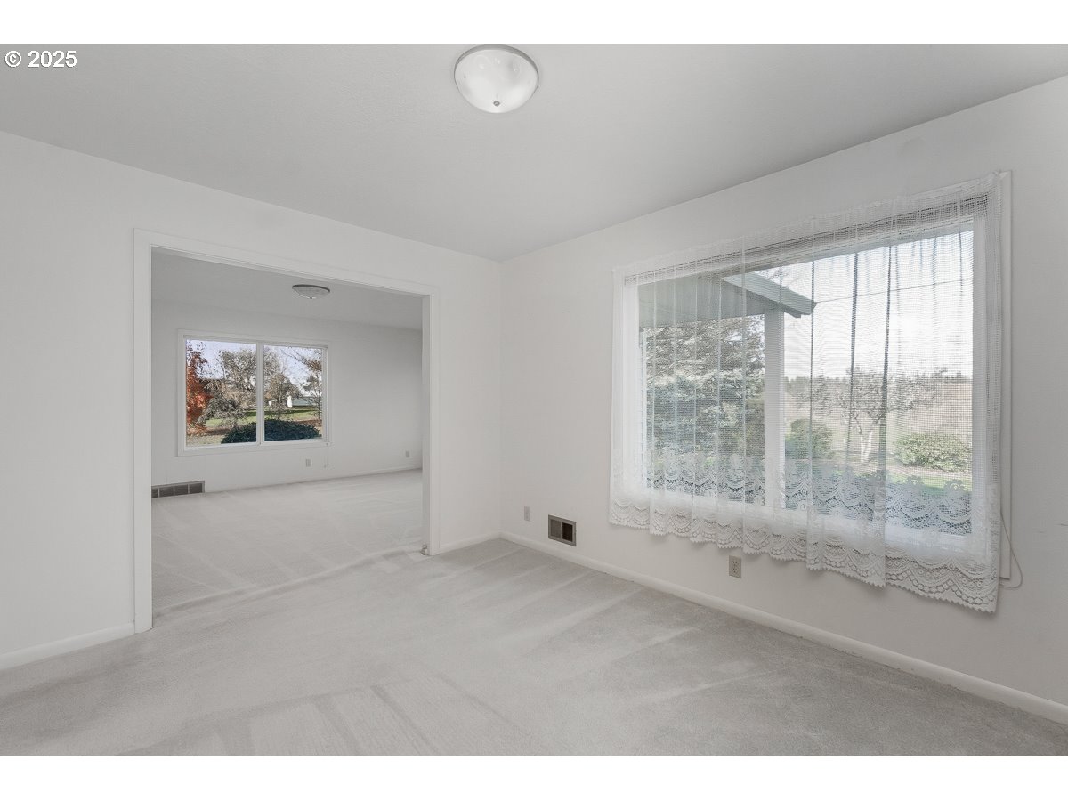 23990 Southwest Tile Flat Road Hillsboro, OR 97123 - Photo 12 of 46 a view of an empty room with a window