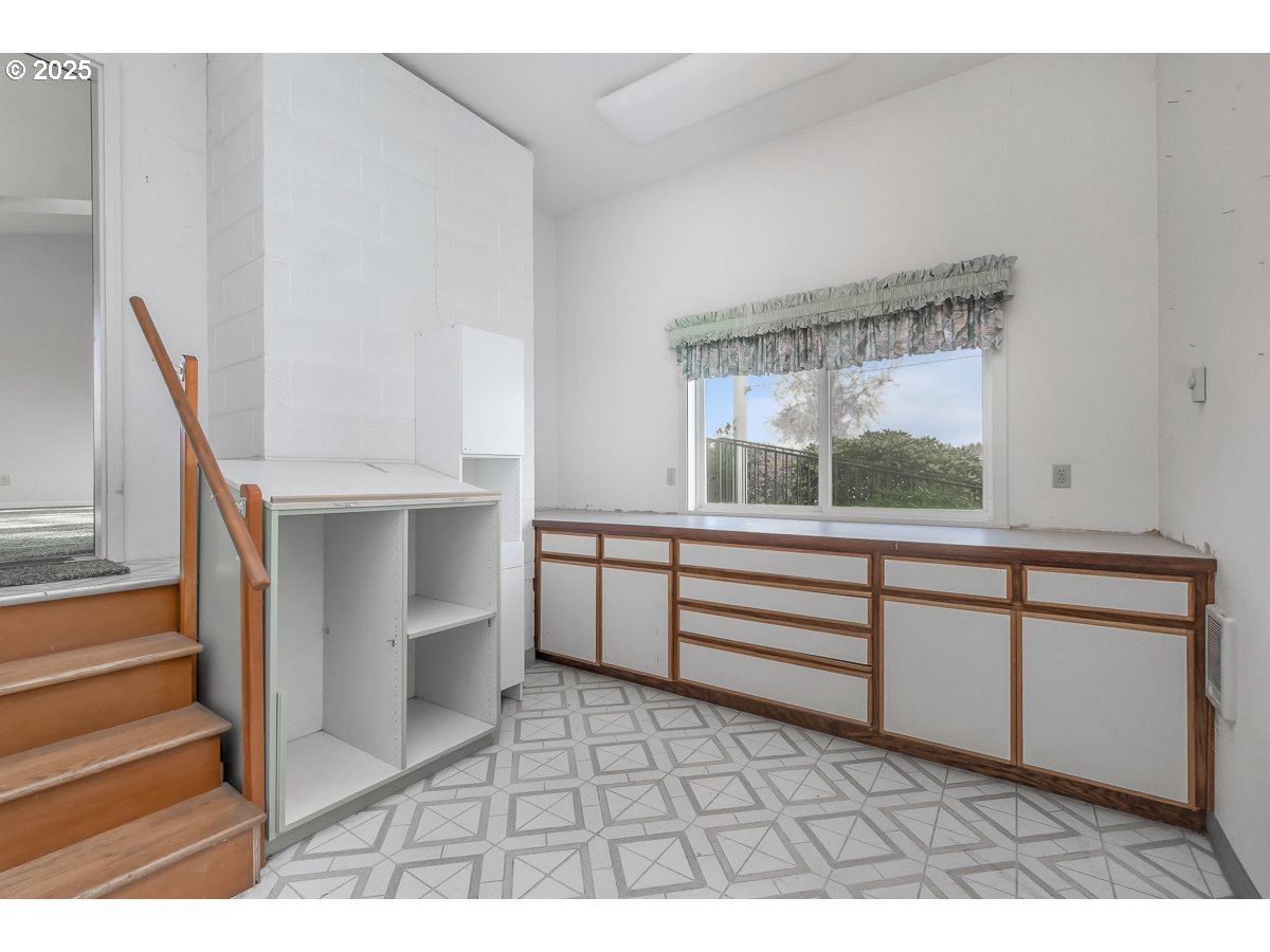 23990 Southwest Tile Flat Road Hillsboro, OR 97123 - Photo 18 of 46 a view of cabinet with chair and white walls