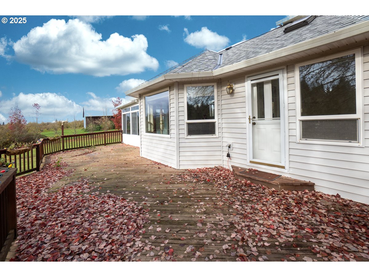 23990 Southwest Tile Flat Road Hillsboro, OR 97123 - Photo 27 of 46 a view of a house with a wooden fence