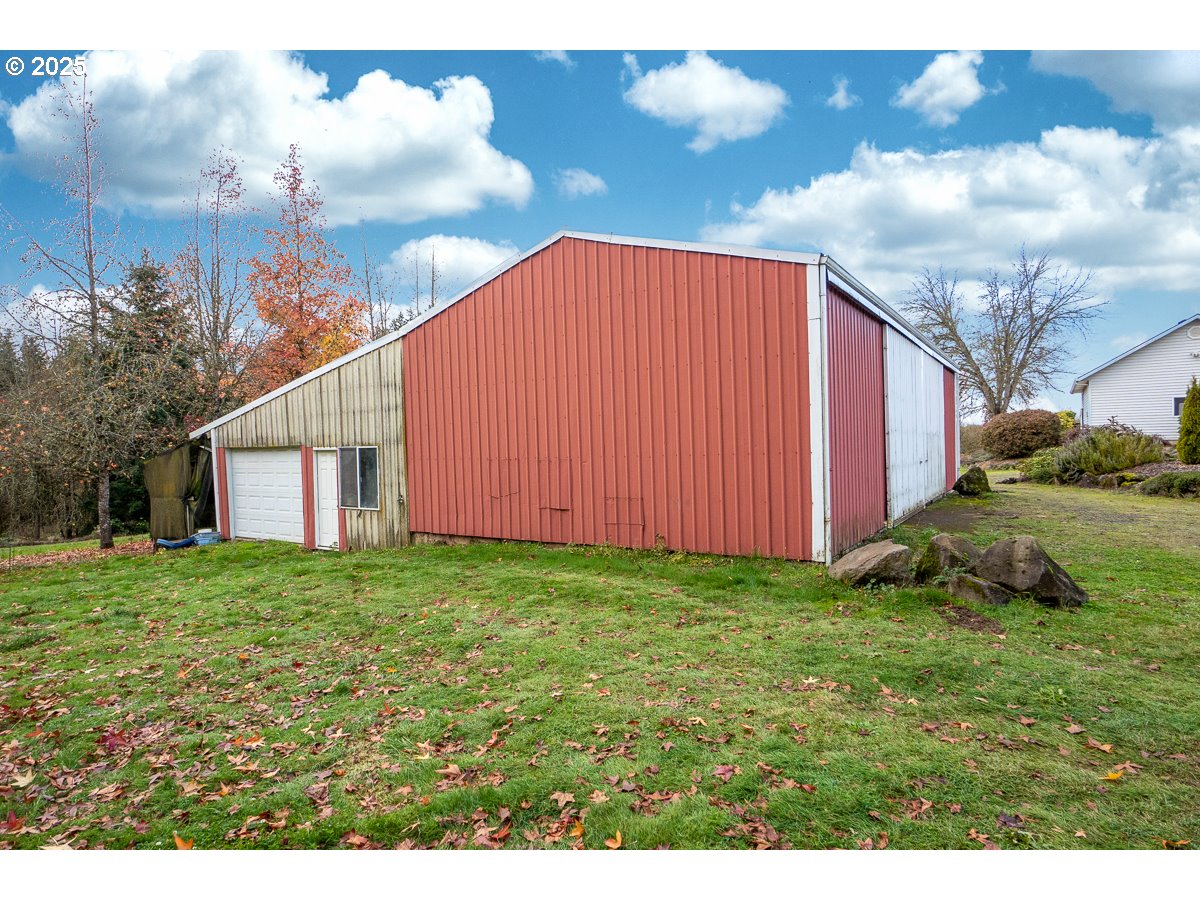 23990 Southwest Tile Flat Road Hillsboro, OR 97123 - Photo 32 of 46 a view of a backyard with potted plants and big yard