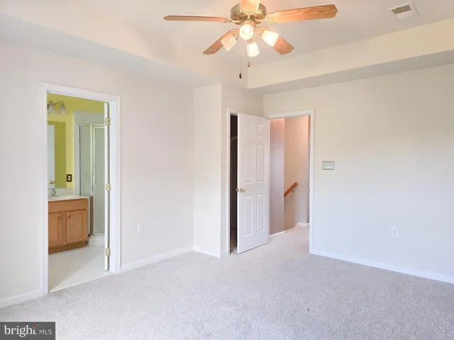 a kitchen with a stove a sink and a microwave
