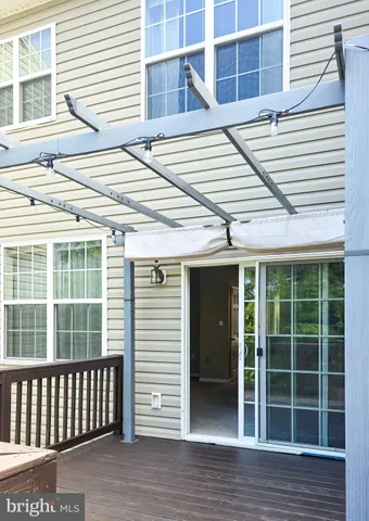 a kitchen with kitchen island granite countertop a stove top oven a sink a counter space and cabinets