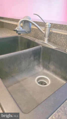 a kitchen with a refrigerator and a stove