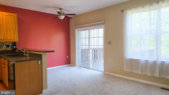 a view of a house with backyard front of house