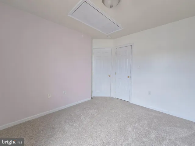 a view of a big room with closet and chandelier fan