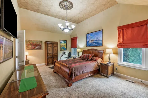 a bedroom with a bed furniture and a window