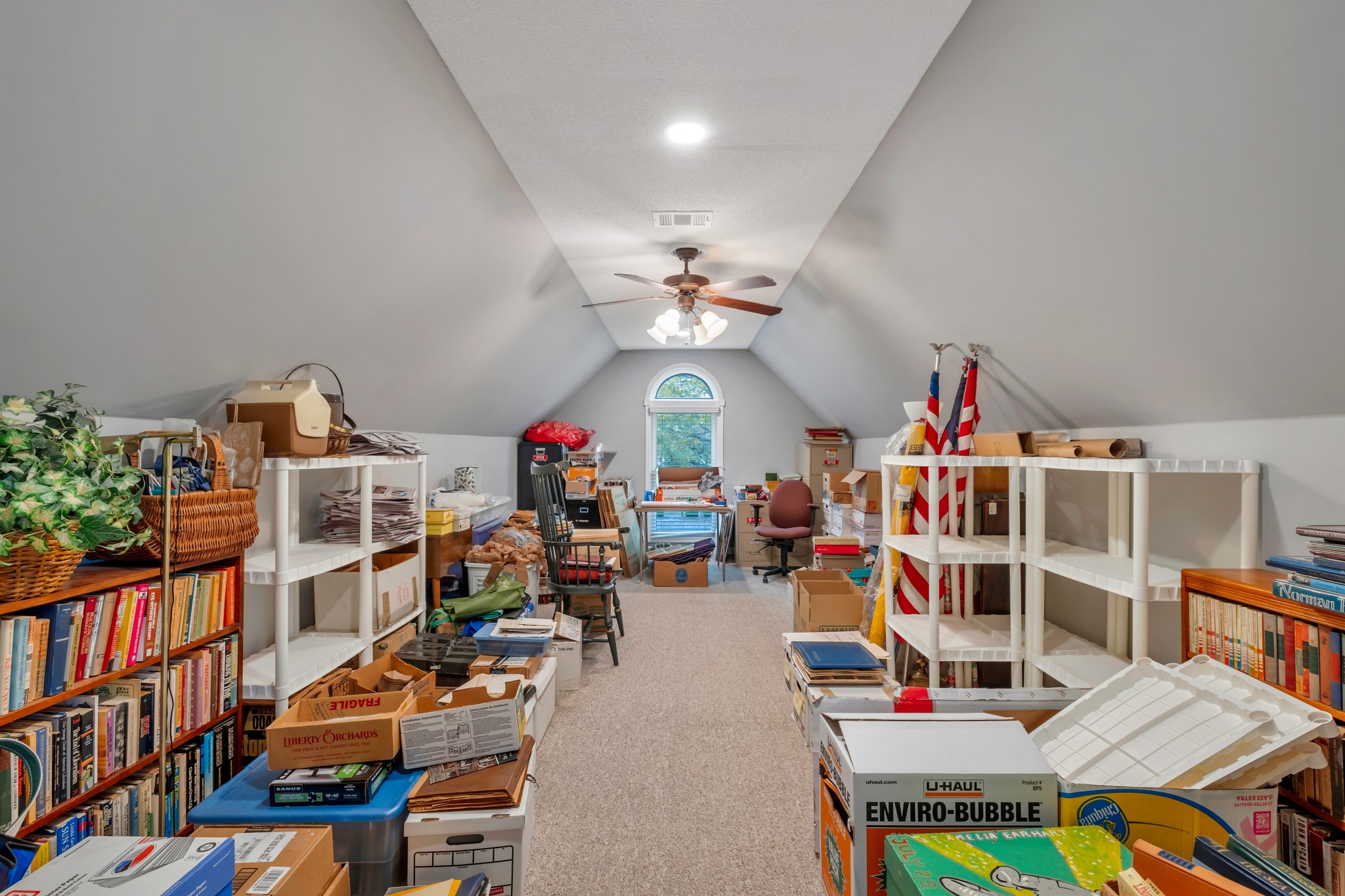 113 Cornerstone Circle Franklin, TN 37064 - Photo 30 of 58 a living room with lots of furniture and a book shelf
