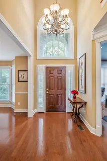 a view of a livingroom with workspace and a bookshelf