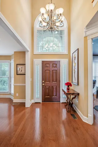 a view of a livingroom with workspace and a bookshelf