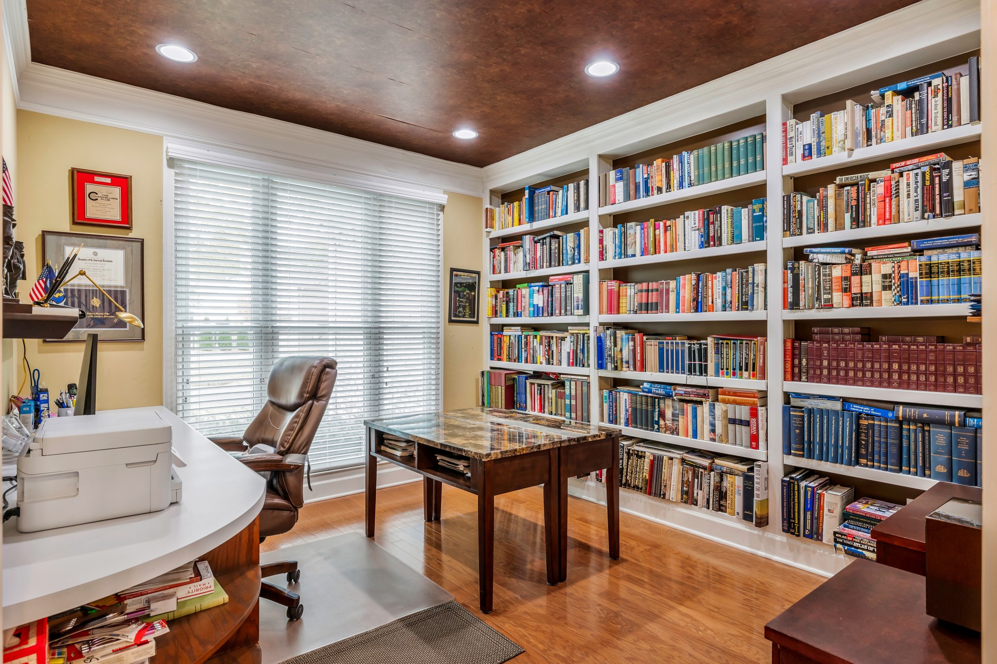 113 Cornerstone Circle Franklin, TN 37064 - Photo 8 of 58 a view of a livingroom with workspace and a bookshelf