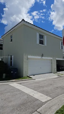 a swimming pool with outdoor seating and yard