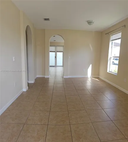 a view of empty room with windows