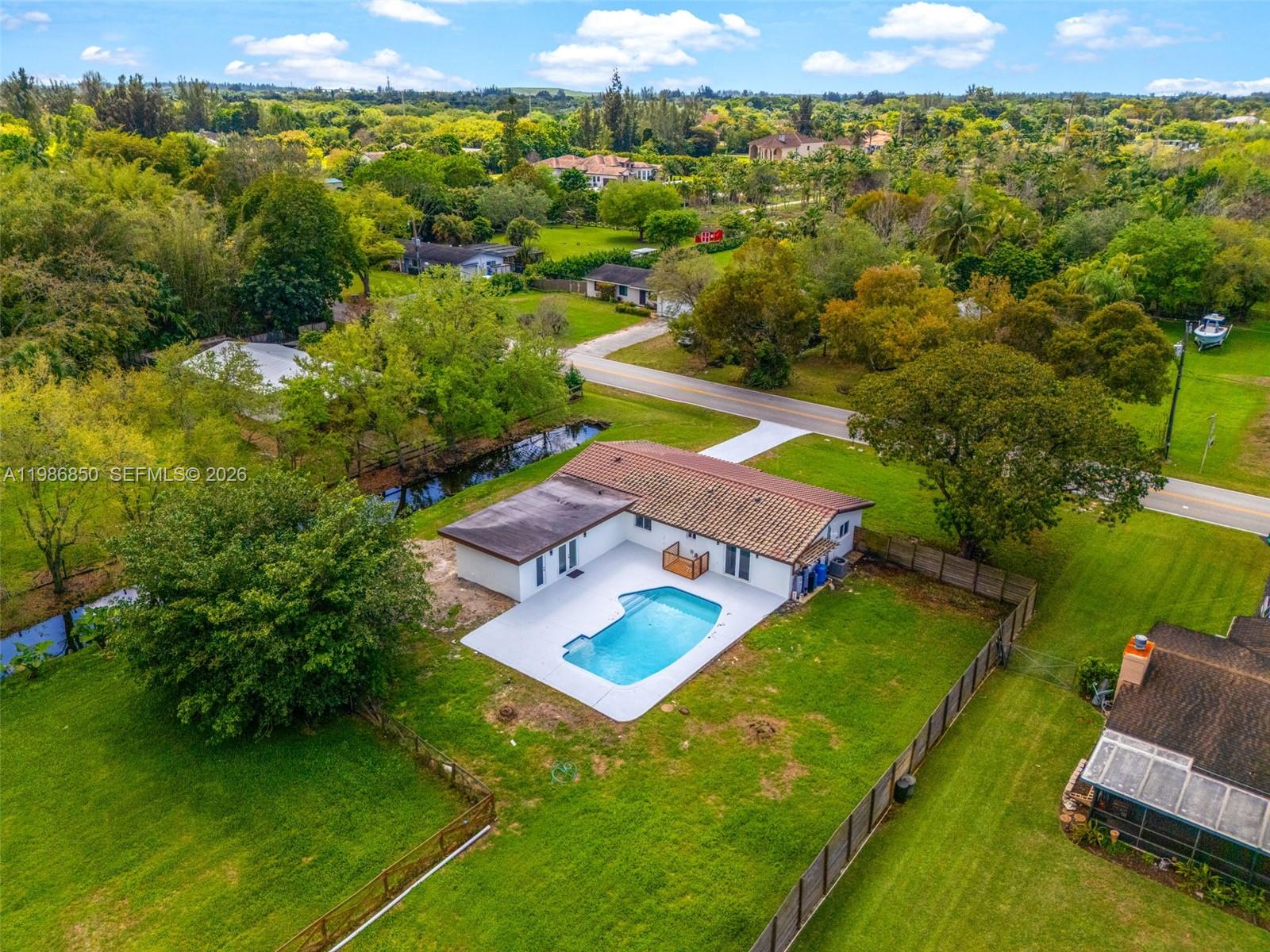 4830 Southwest 188th Avenue Southwest Ranches, FL 33332 - Photo 2 of 58 an aerial view of a house with a garden