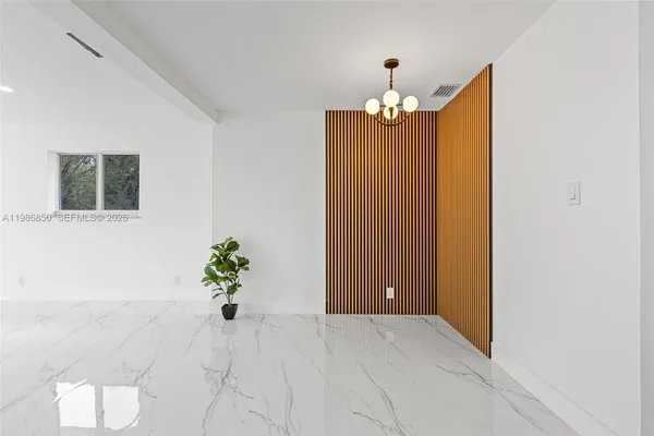 a bathroom with a granite countertop sink mirror toilet and bathtub