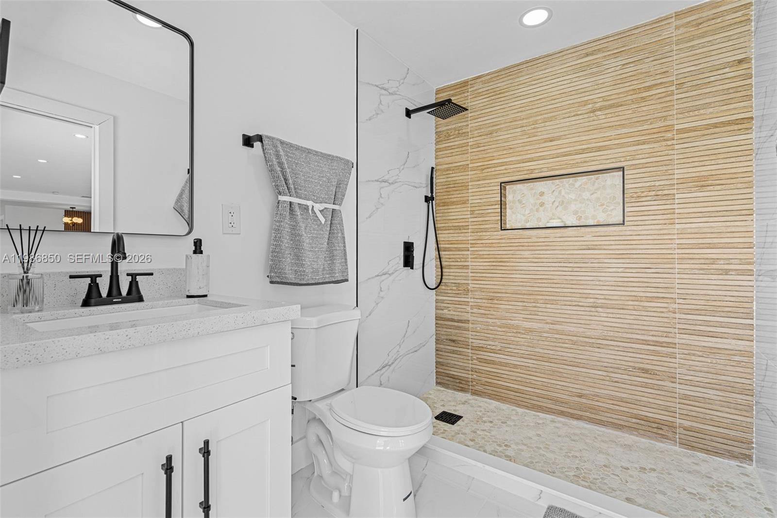 4830 Southwest 188th Avenue Southwest Ranches, FL 33332 - Photo 33 of 58 a bathroom with a sink a toilet and shower