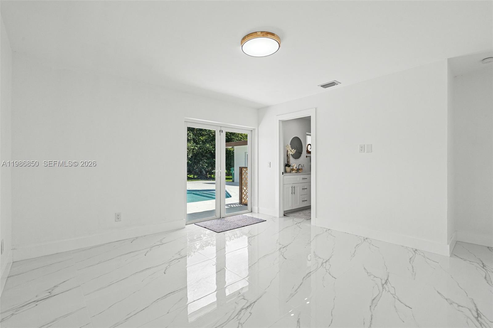 4830 Southwest 188th Avenue Southwest Ranches, FL 33332 - Photo 45 of 58 a view of an empty room with glass door