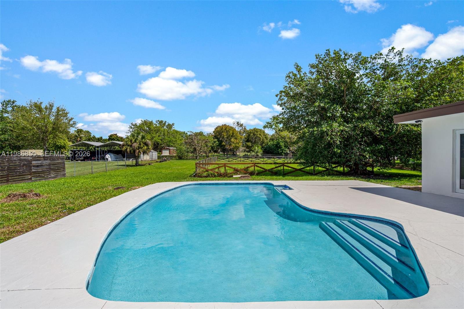 4830 Southwest 188th Avenue Southwest Ranches, FL 33332 - Photo 49 of 58 a view of a golf course with a swimming pool