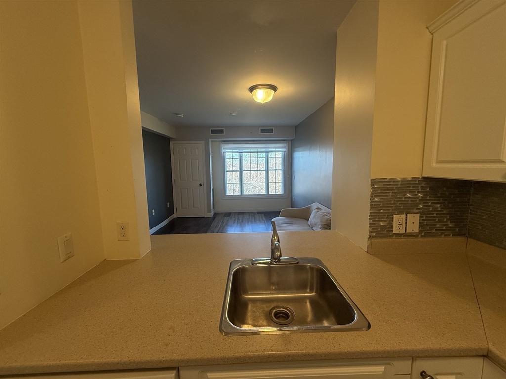 145 Bennington Street, Unit 307 Revere, MA 02151 - Photo 3 of 7 a room with a couch