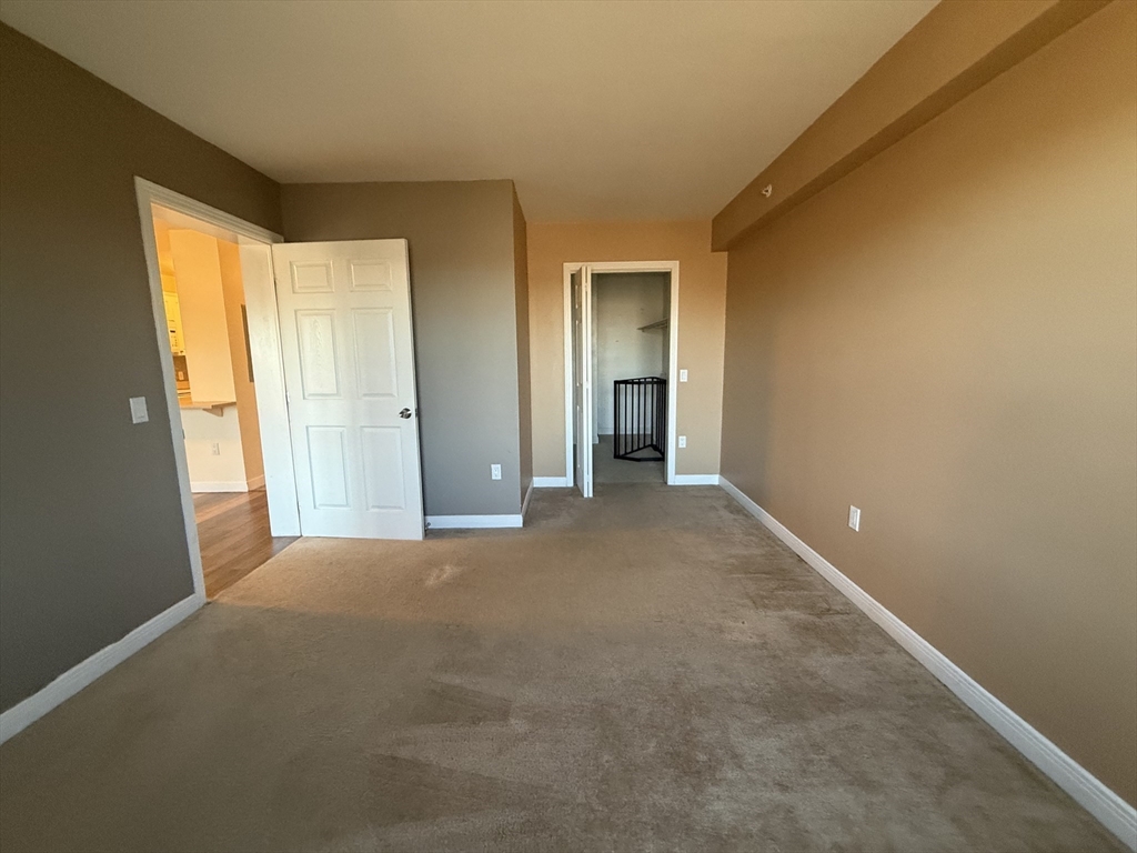145 Bennington Street, Unit 307 Revere, MA 02151 - Photo 5 of 7 a view of a big room with windows and closet