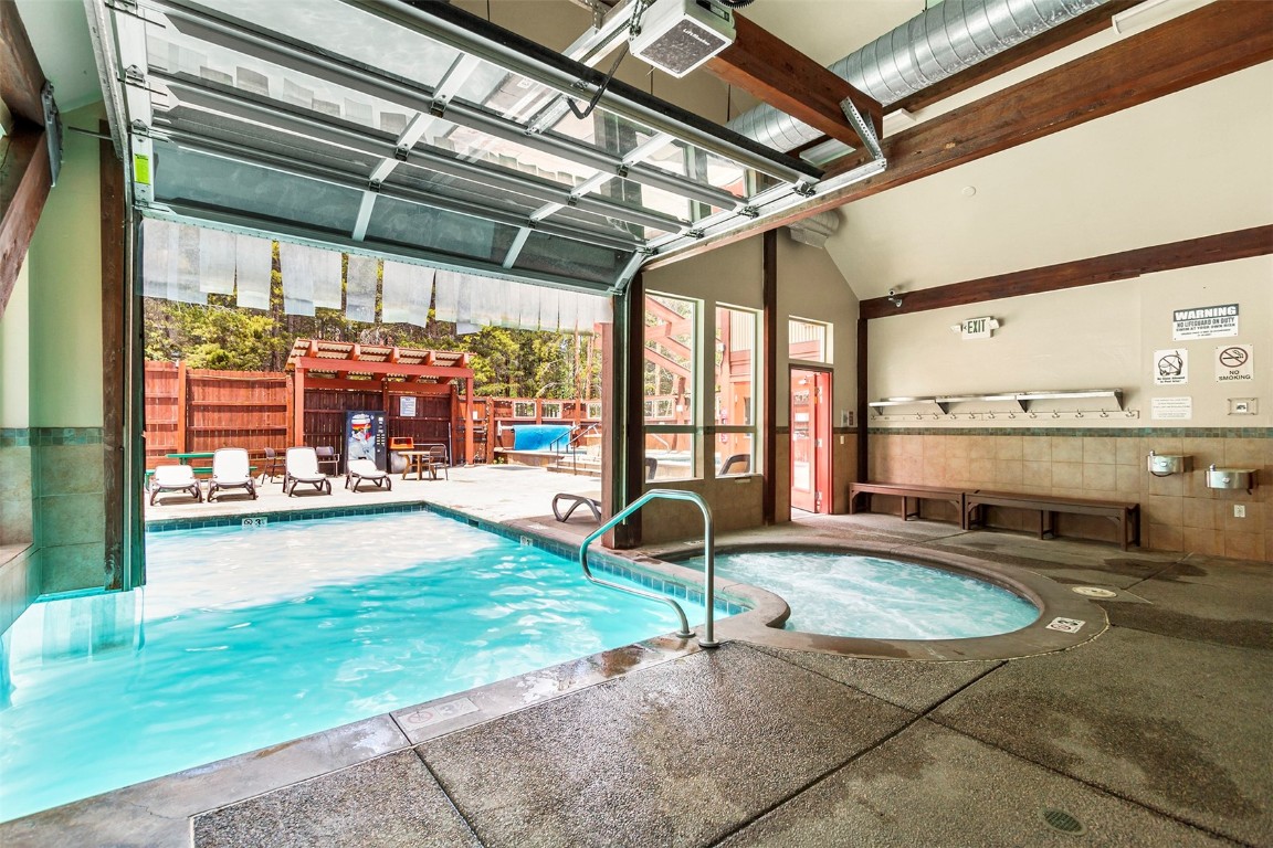 405 4 O Clock Road, Unit 12B Breckenridge, CO 80424 - Photo 21 of 27 a swimming pool with an outdoor seating space