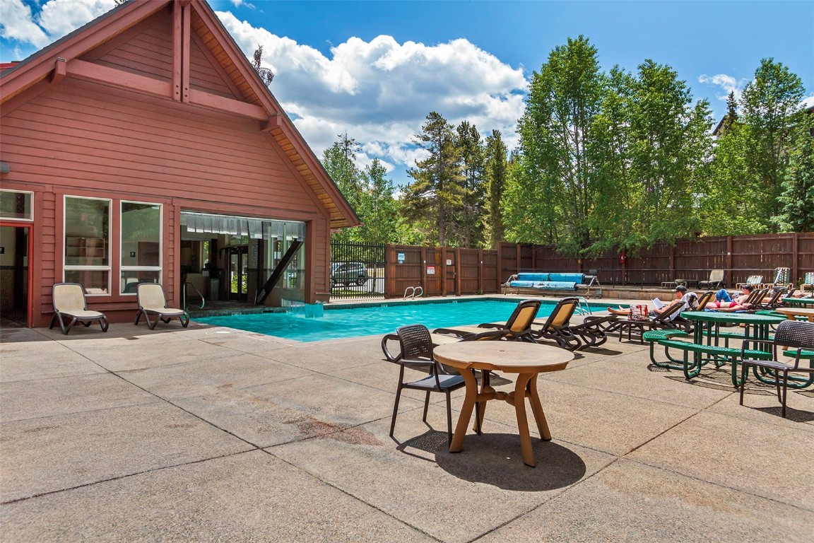 405 4 O Clock Road, Unit 12B Breckenridge, CO 80424 - Photo 23 of 27 a patio with table and chairs and potted plants