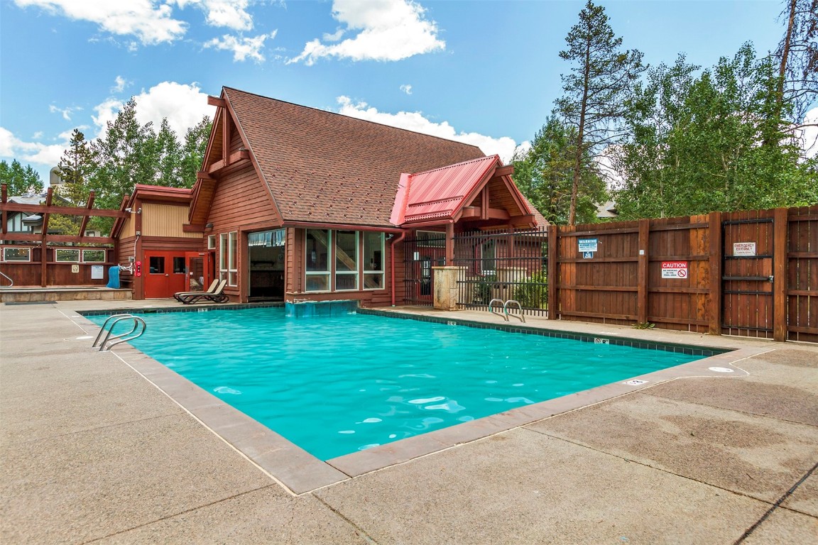 405 4 O Clock Road, Unit 12B Breckenridge, CO 80424 - Photo 24 of 27 a front view of a house with a yard