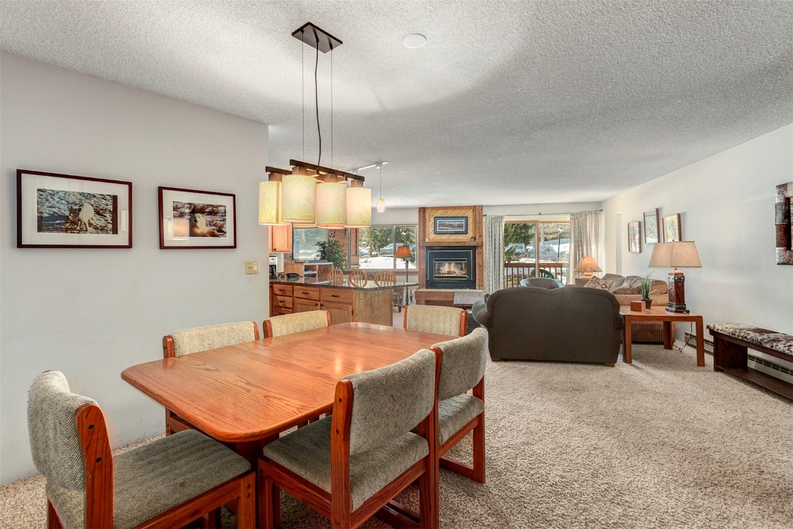 405 4 O Clock Road, Unit 12B Breckenridge, CO 80424 - Photo 4 of 27 a dining room with furniture and window