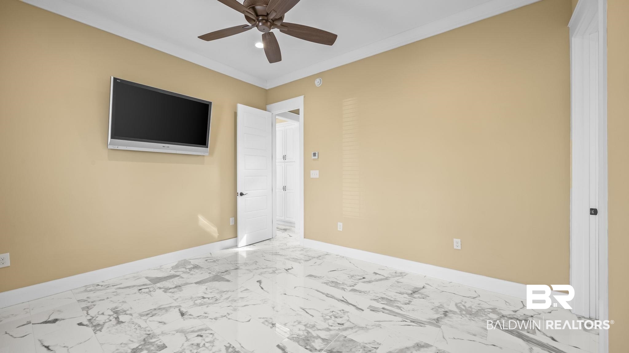 12004 Raptor Court Elberta, AL 36530 - Photo 17 of 57 Unfurnished bedroom with marble finish floors, ceiling fan, and ornamental molding