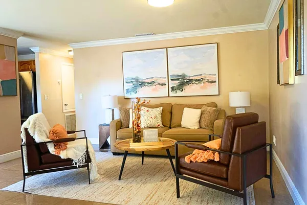 a living room with furniture and a window