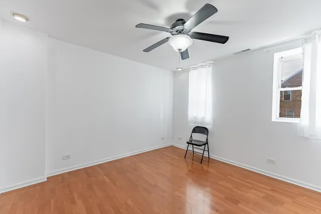 wooden floor in a room with a window