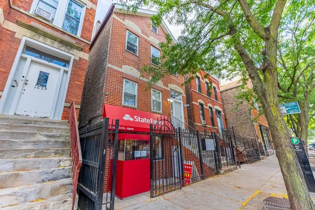 a view of buildings with brick walls
