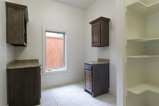 a room with window and cabinet