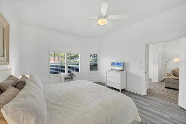 a bedroom with a bed and a couch