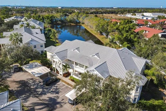 an aerial view of a house with a lake view