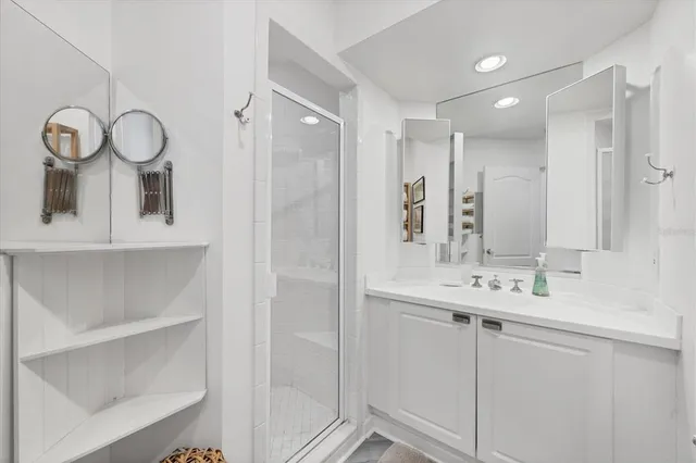 a bathroom with a double vanity sink mirror and double