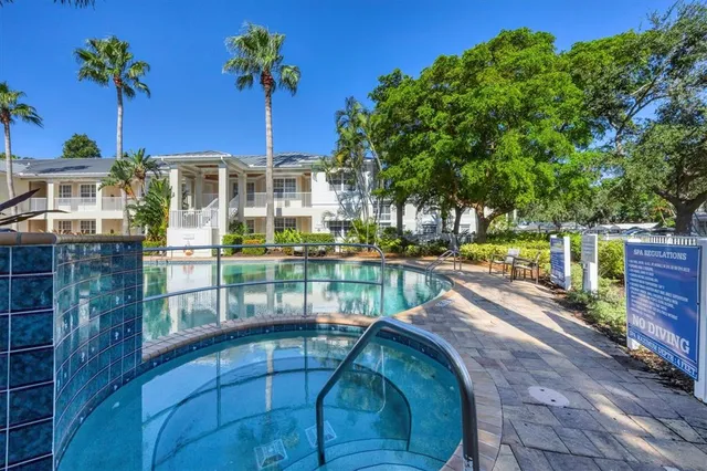 a view of a swimming pool with a patio