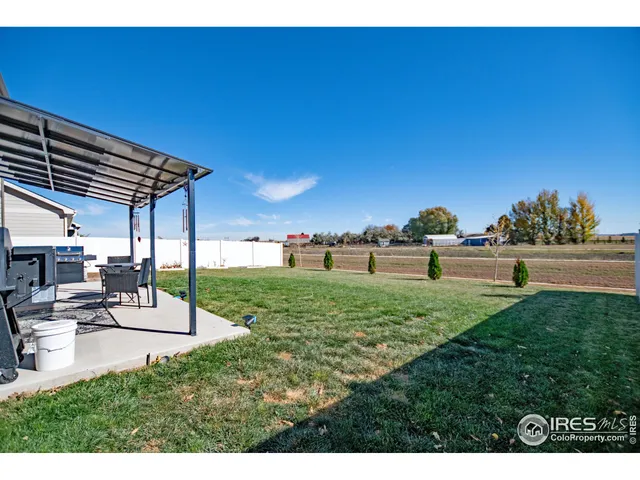 a view of a backyard with sitting area