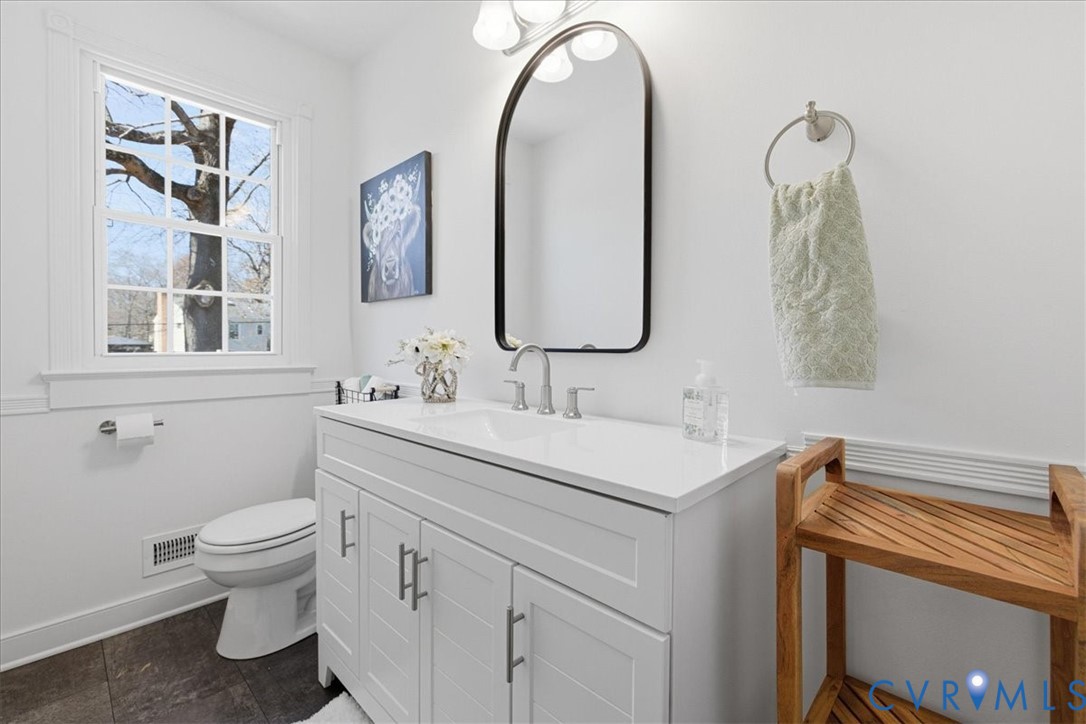 11719 Heathmere Crescent Midlothian, VA 23113 - Photo 14 of 31 a bathroom with a toilet sink and mirror