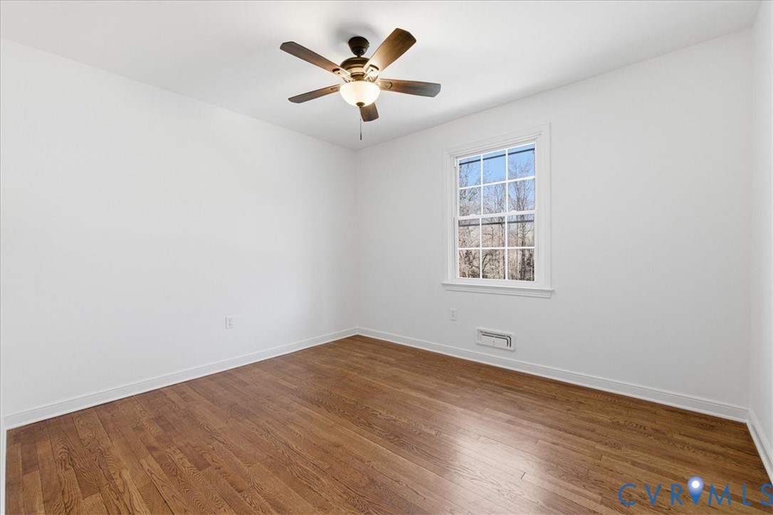 11719 Heathmere Crescent Midlothian, VA 23113 - Photo 16 of 31 an empty room with wooden floor and windows