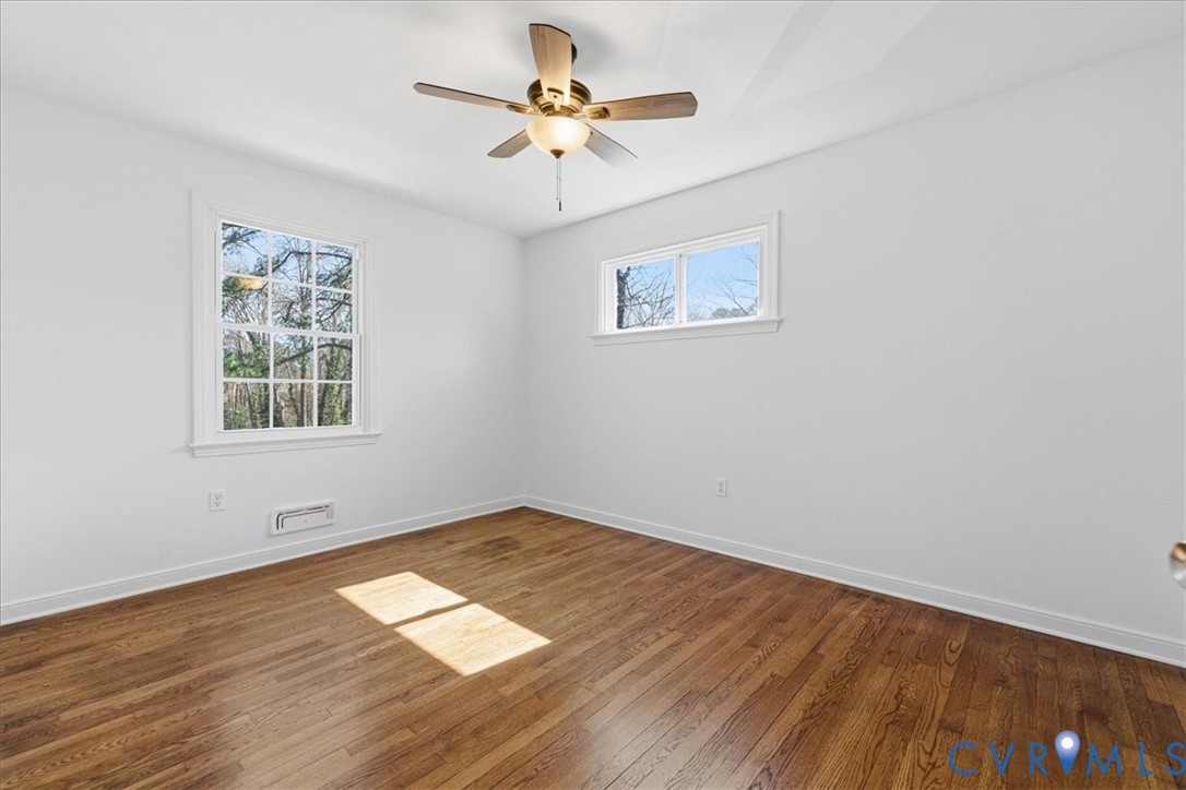 11719 Heathmere Crescent Midlothian, VA 23113 - Photo 17 of 31 an empty room with wooden floor and windows