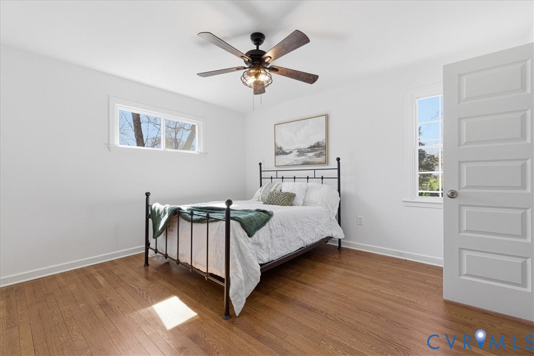 11719 Heathmere Crescent Midlothian, VA 23113 - Photo 18 of 31 a bedroom with a bed and a chandelier