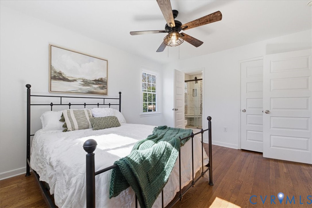 11719 Heathmere Crescent Midlothian, VA 23113 - Photo 19 of 31 a bedroom with a bed and wooden floor