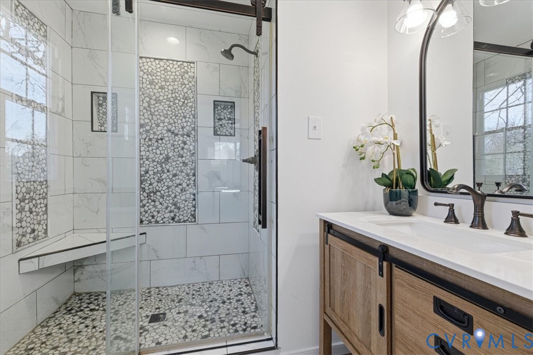 11719 Heathmere Crescent Midlothian, VA 23113 - Photo 20 of 31 a bathroom with a granite countertop sink a mirror and shower