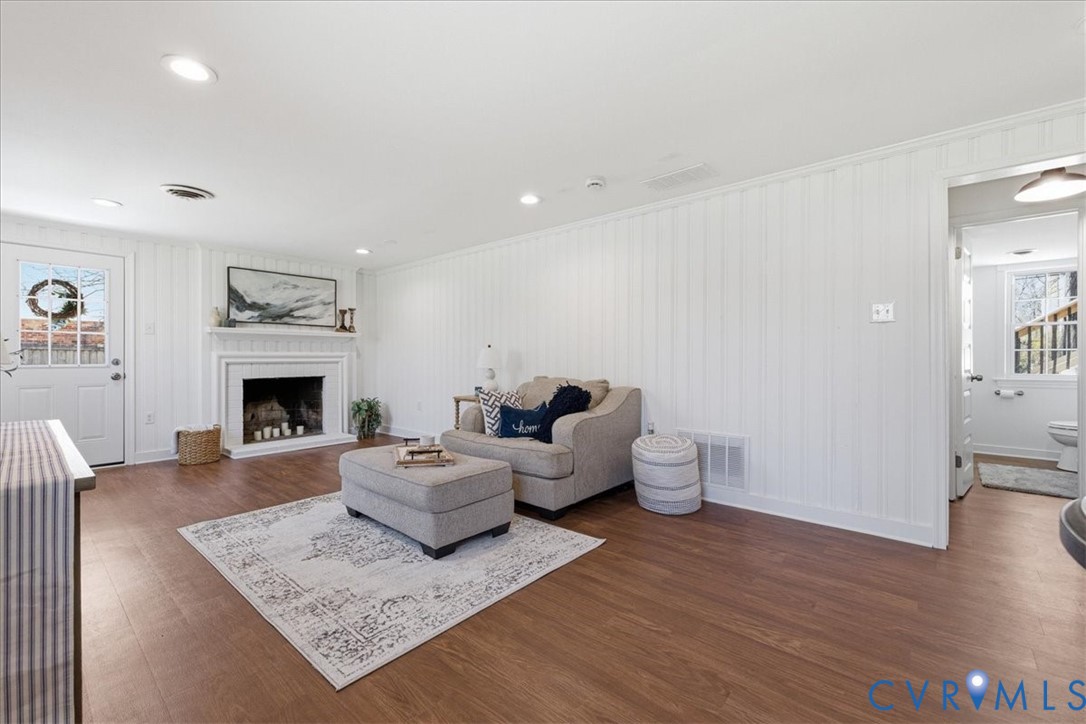 11719 Heathmere Crescent Midlothian, VA 23113 - Photo 26 of 31 a living room with furniture and a fireplace