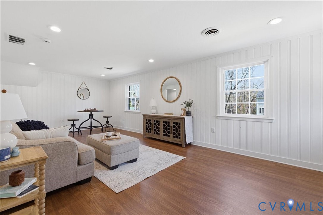 11719 Heathmere Crescent Midlothian, VA 23113 - Photo 27 of 31 a living room with furniture a fireplace and a window