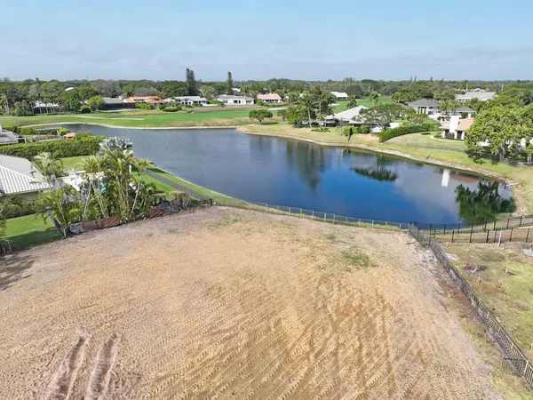 a view of a lake with houses in the back