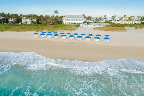 a view of lawn chairs under an umbrella