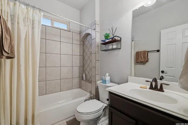 a bedroom with a bed and a television