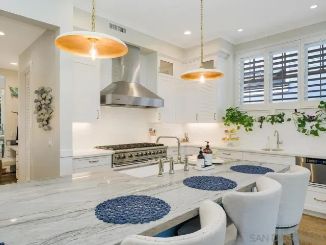a kitchen with a table and chairs in it