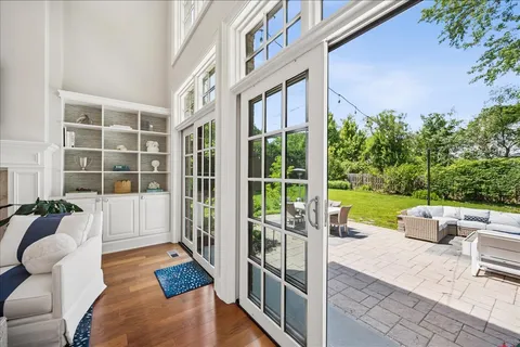 a large white kitchen with a large window